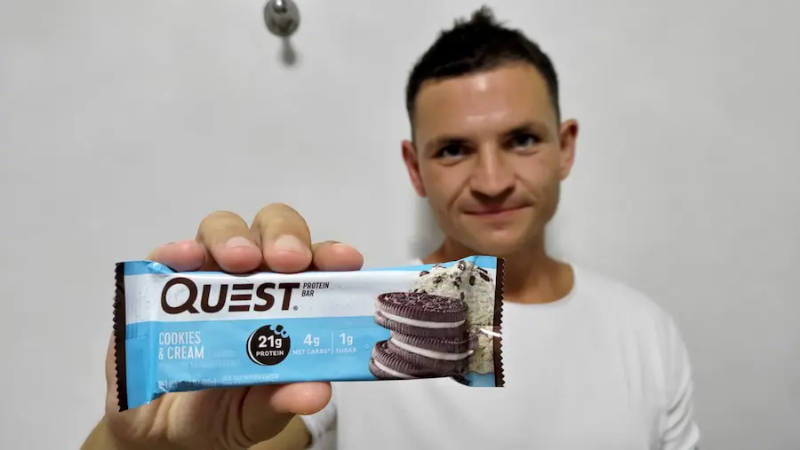 photo of me holding optavia bars and quest bars