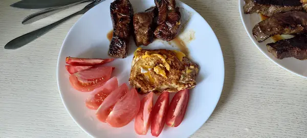 photo of my lean and green meal with steak and tomatoes