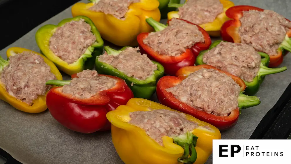 Stuffed bell peppers with ground beef on a baking sheet for the oven