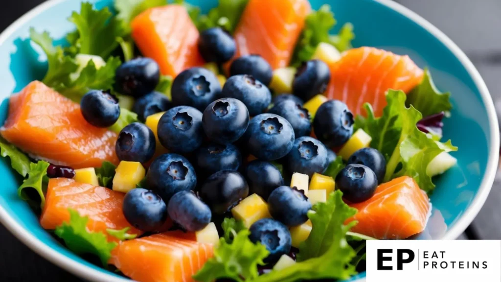 A colorful salad bowl with fresh blueberries, flaky salmon, and vibrant greens arranged in an appealing composition