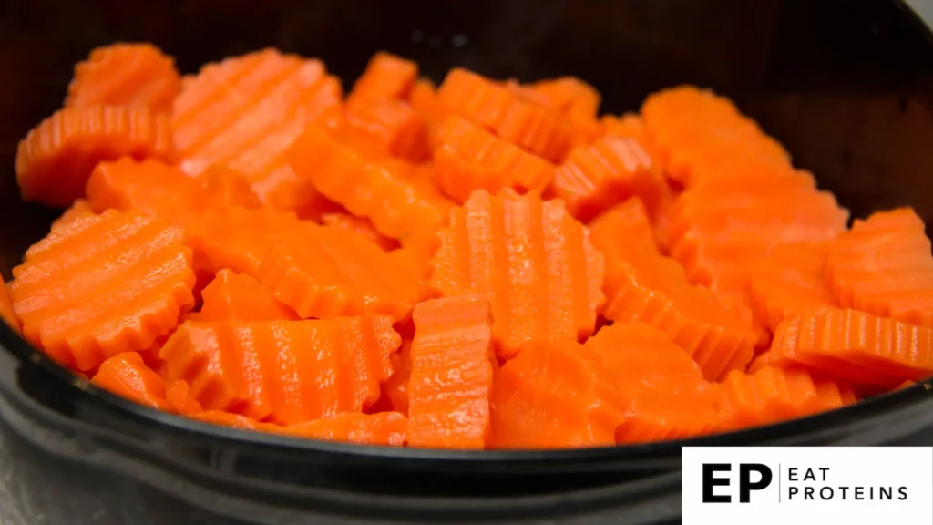 A pot of boiled chopped carrots 