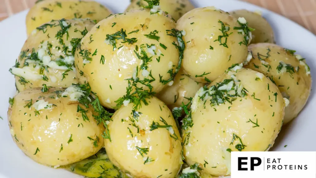 A pot of boiled potatoes sprinkled with salt, garlic