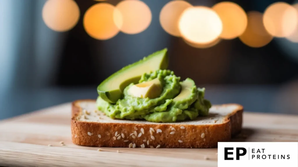 A slice of whole grain toast topped with mashed avocado