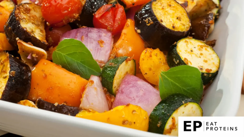 A colorful array of roasted vegetables arranged on a platter, featuring a variety of textures and colors