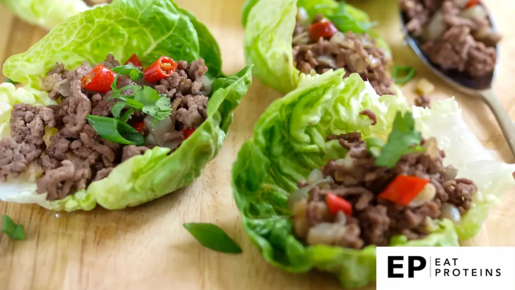 lettuce wraps with fried ground beef on the wooden board