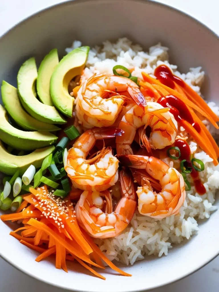 A vibrant and healthy shrimp bowl with cooked rice, juicy shrimp, sliced avocado, shredded carrots, green onions, and a drizzle of hot sauce. The bowl looks delicious and perfect for a quick and satisfying meal.