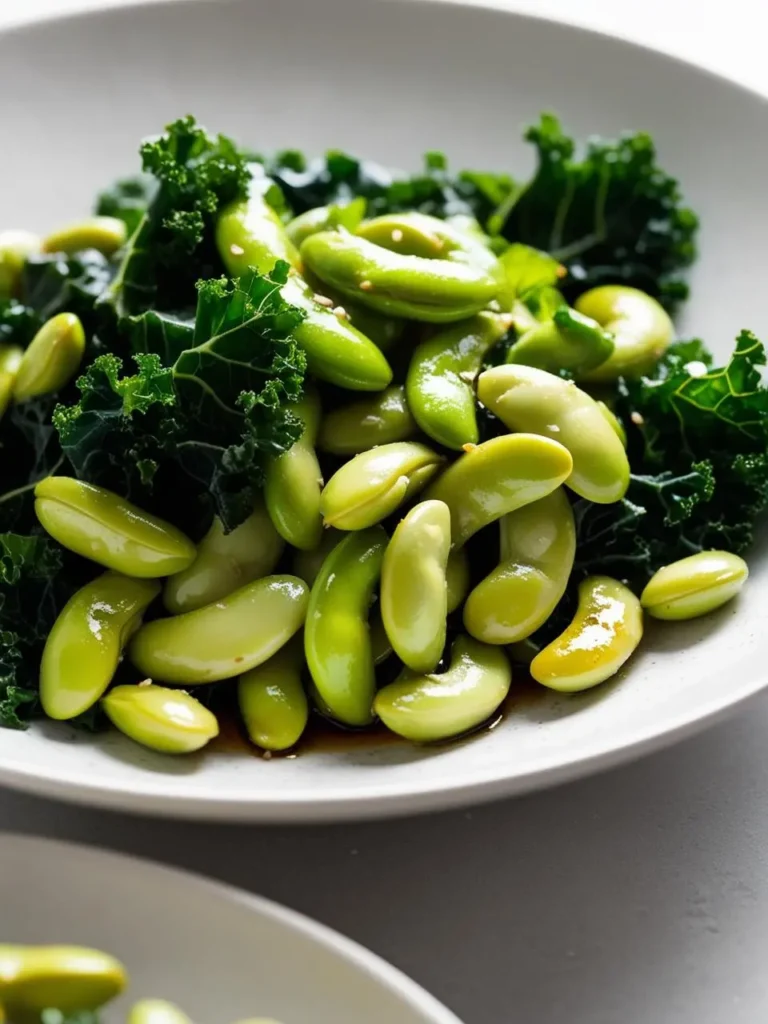 A plate of vibrant green edamame beans tossed with fresh kale. The edamame is lightly seasoned and sprinkled with sesame seeds, making it a healthy and delicious side dish.