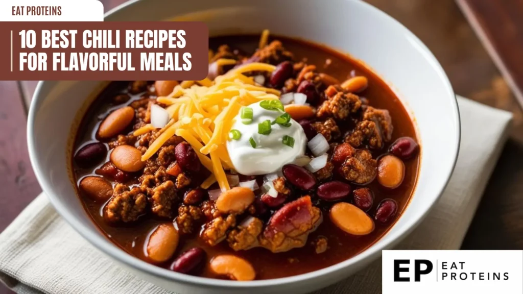 a bowl of chili with toppings on a wooden table. the chili includes ground meat, beans, and a red broth. it's topped with shredded cheese, sour cream, and chopped onions. a banner at the top reads "10 best chili recipes for flavorful meals." the "eat proteins" logo is in the top left and bottom right corners. a light cloth is visible